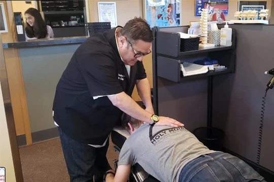 Chiropractor West Seattle WA Lawrence Clayman Adjusting Patient